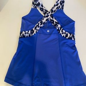 Lululemon size 8 cross Cross Cheetah and blue Tank. Preowned.
